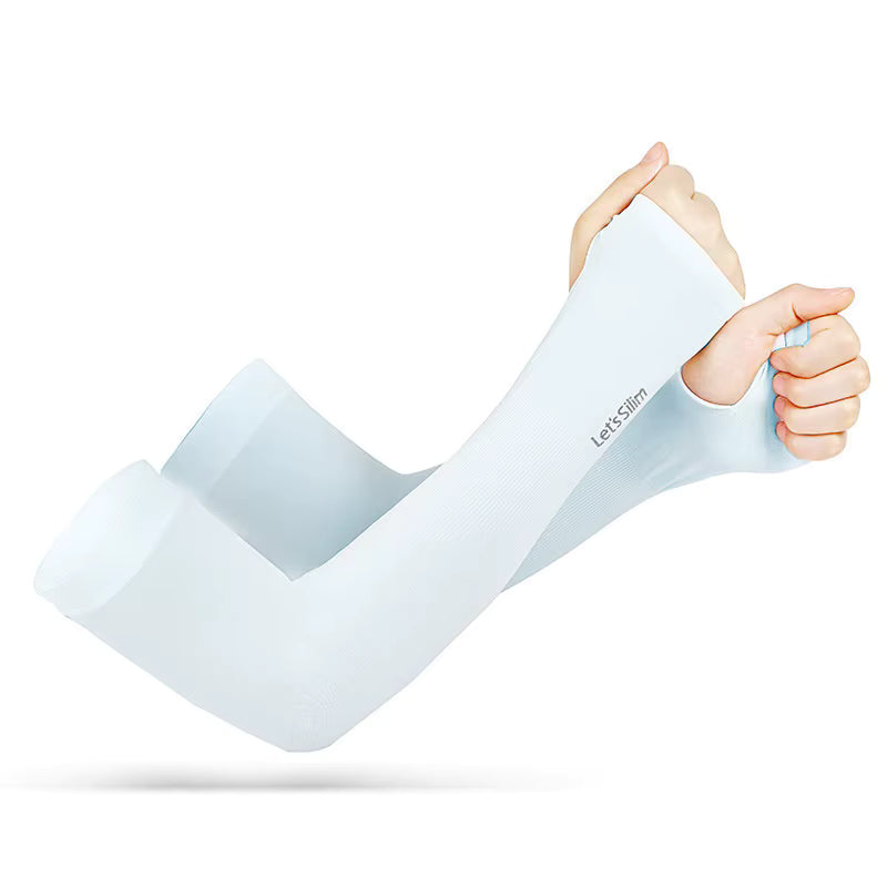 A person stretches a pale blue TattooGuard SPF Sun Protection Sleeve by TBNC - The Best Numbing Cream over their left arm, using their right hand to pull it up. This sleeve provides UV and tattoo protection from harmful sun exposure.