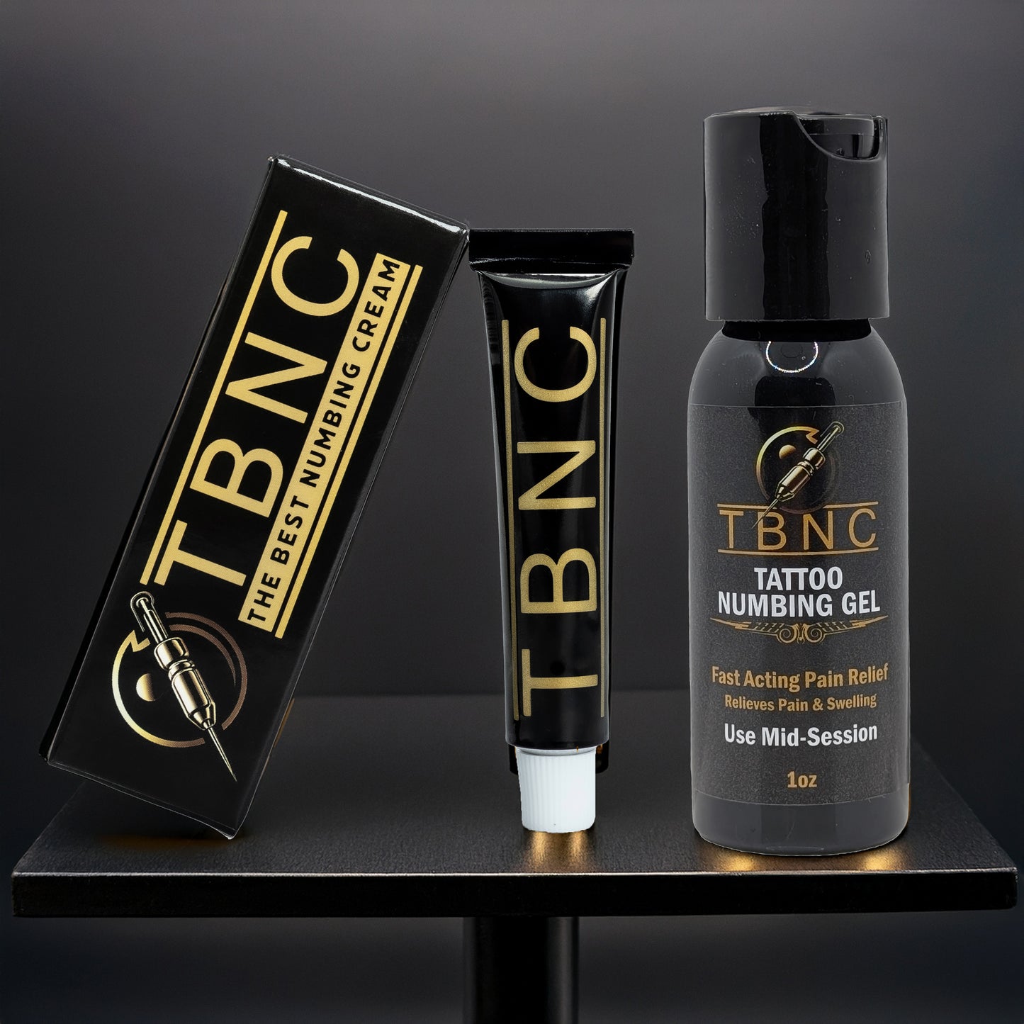 The TBNC - The Best Numbing Cream Tattoo Numbing Bundle is shown against a black background, featuring a boxed numbing cream tube, the cream tube, and a 1oz numbing gel bottle—your all-in-one tattoo numbing solution.