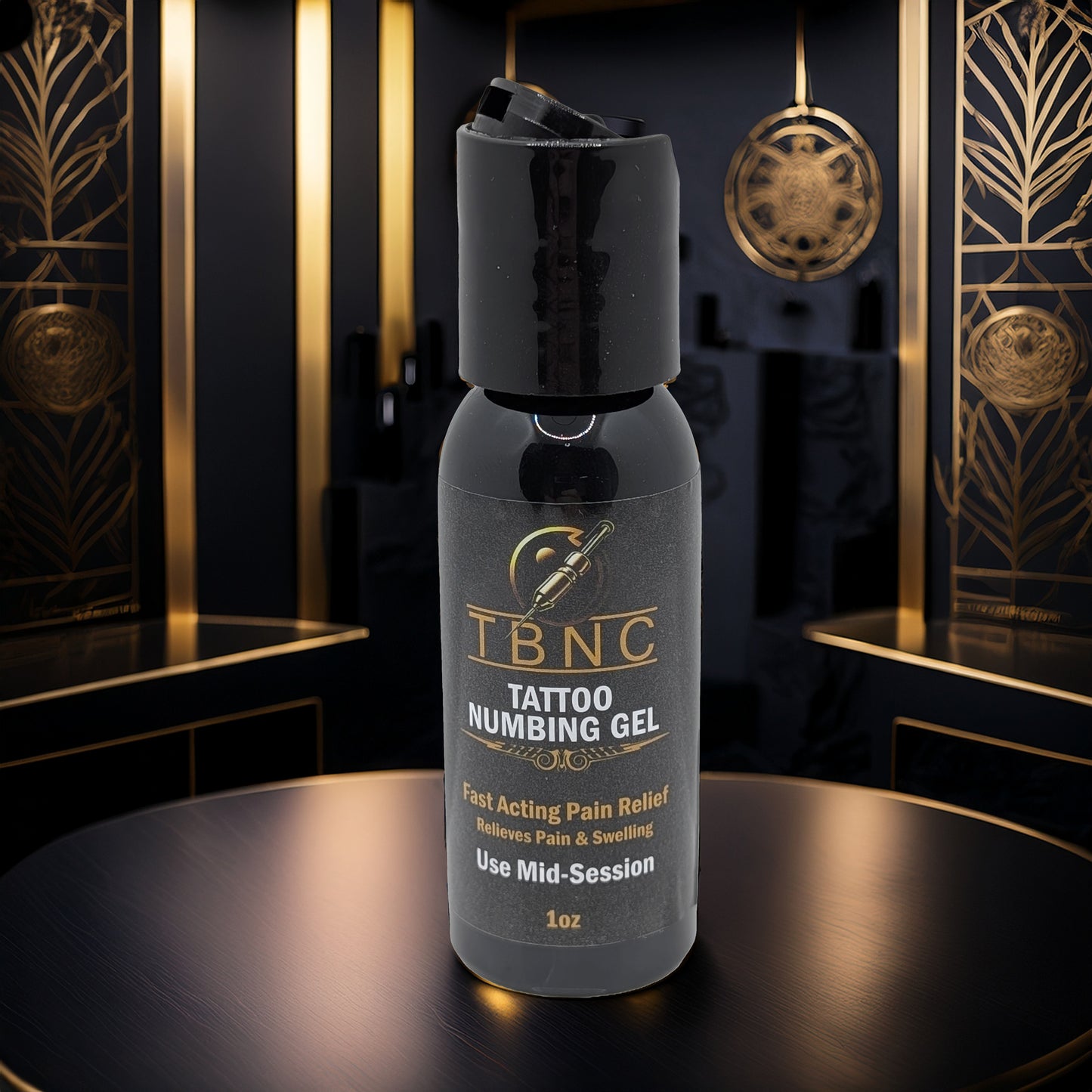 A bottle of TBNC - The Best Numbing Cream "Tattoo Numbing Gel - Mid Session" rests on a reflective surface in an elegant art deco-style black and gold room, with the label highlighting fast pain relief for comfortable tattoo sessions.