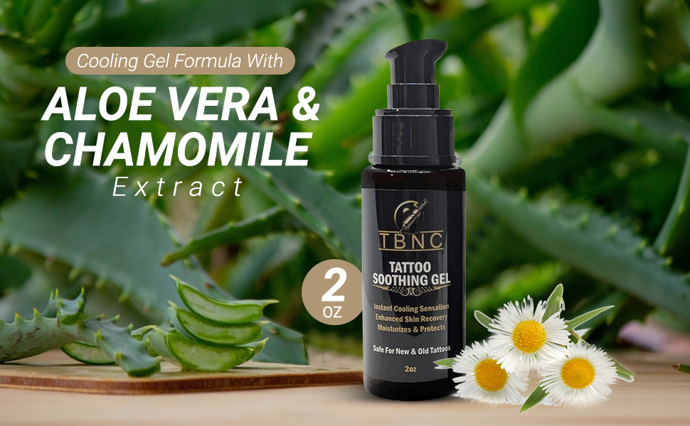 A 2 oz bottle of TBNC - The Best Numbing Cream Tattoo Soothing Gel rests on wood beside aloe vera leaves and chamomile flowers, highlighting its soothing formula with aloe and chamomile extracts to enhance tattoo vibrancy.
