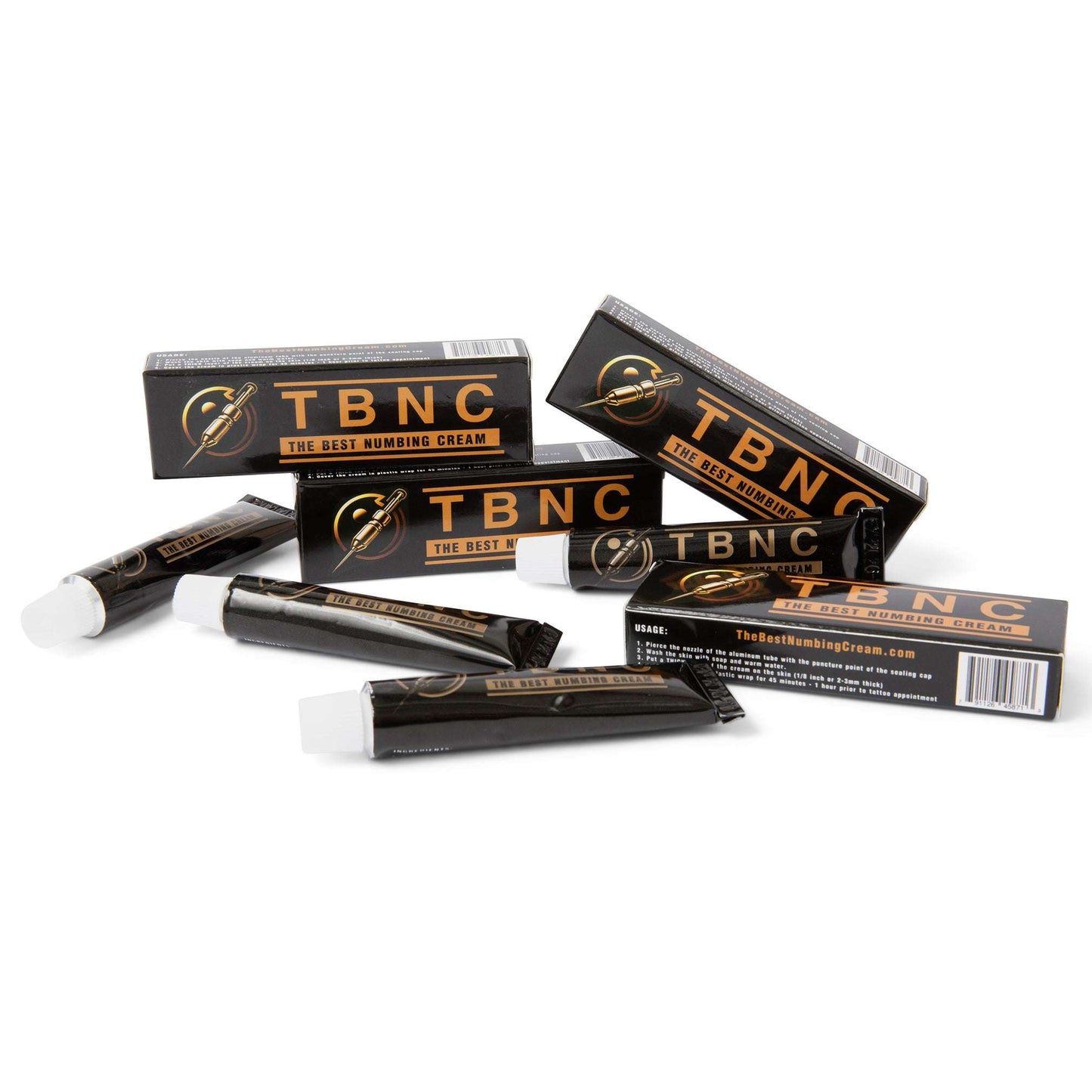 Black and gold TBNC - The Best Numbing Cream tubes and cartons are scattered on a white surface, showcasing the product name "The Best Numbing Cream - TBNC - 4 Pack," ideal for painless tattoos during tattoo sessions.