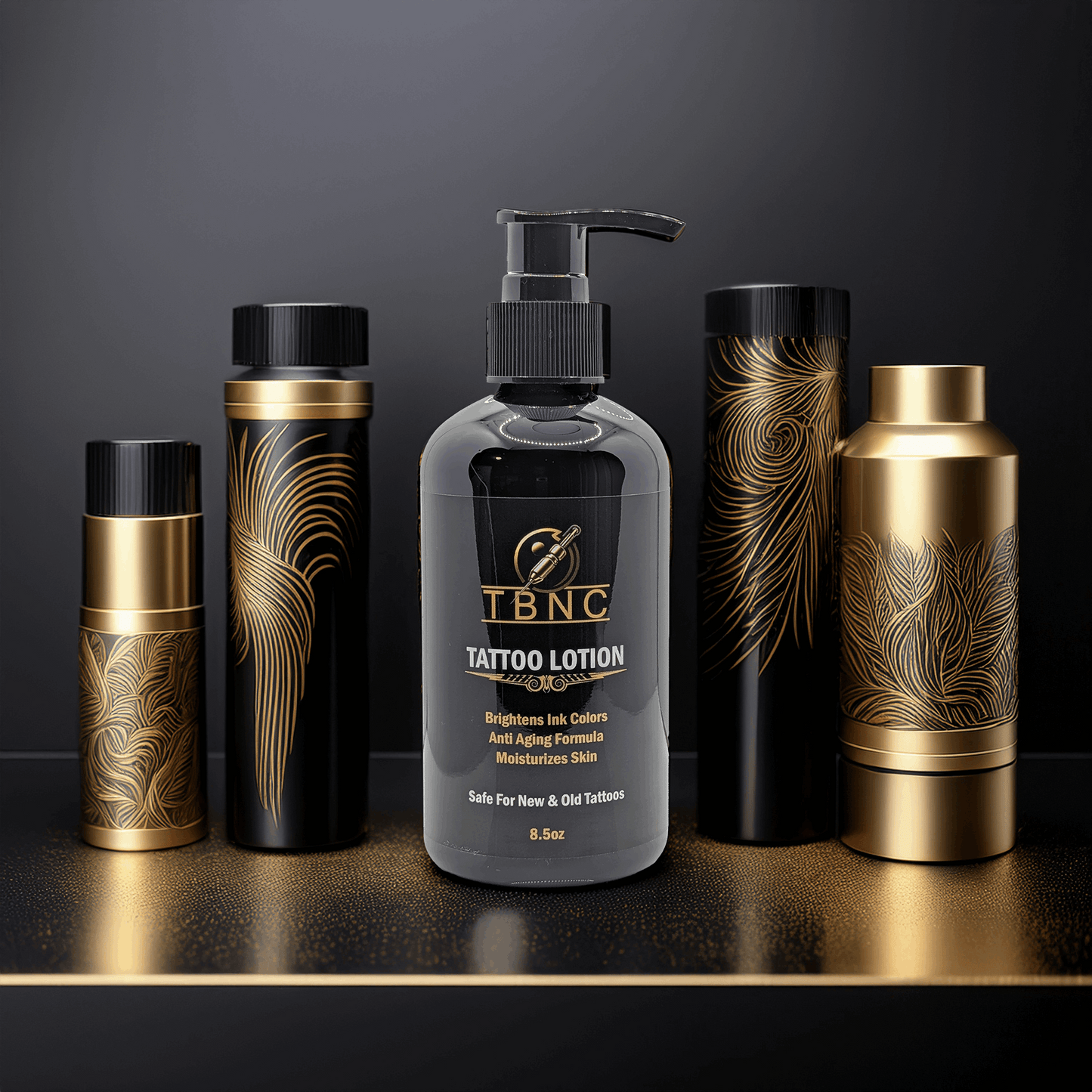 A bottle of TBNC - The Best Numbing Cream Tattoo Lotion - Peppermint with a pump stands among four black and gold feather-patterned containers on a reflective surface. This lotion moisturizes skin, boosts tattoo vibrancy, and offers anti-aging benefits.