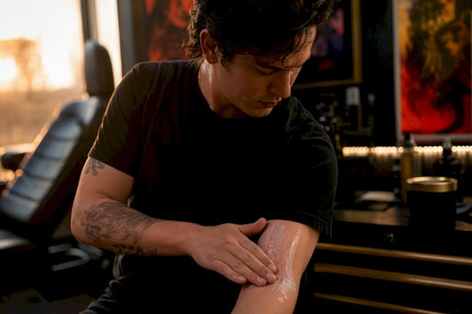 Applying numbing cream on forearm before tattoo