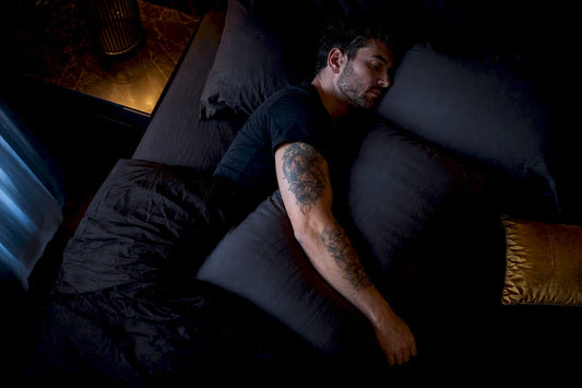 Fresh tattoo sleeping setup with pillow barrier