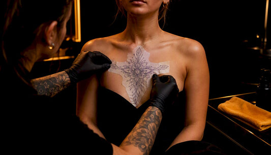 Artist positioning stencil for sternum tattoo