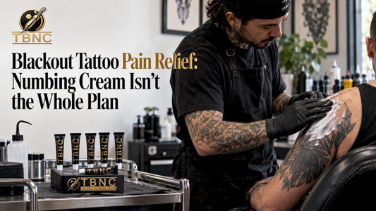 Artist preparing a client for blackout tattooing