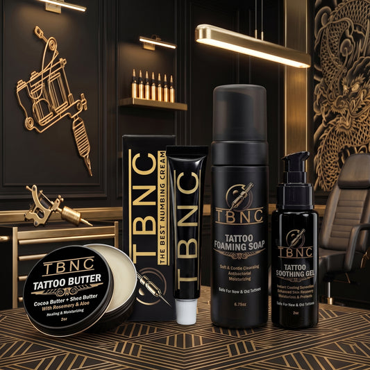 A chic gold and black tattoo studio showcases top-selling numbing cream, best-rated aftercare essentials, and professional gear.