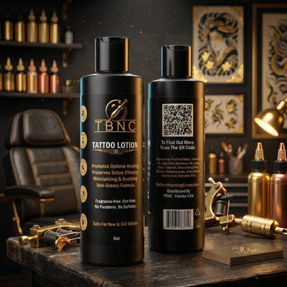 Two premium TBNC Tattoo Aftercare Lotion bottles shine, featuring benefits and directions, with tattoo tools in the background.