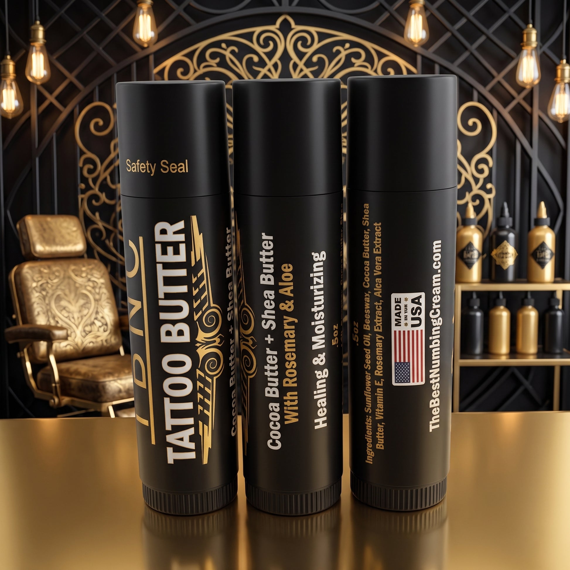 Three Tattoo Butter Travel Sticks (3pack) by The Best Numbing Cream on a gold counter, shown as premium tattoo aftercare essentials.