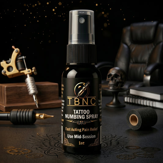 TBNC Tattoo Numbing Spray bottle with tattoo equipment in the background
