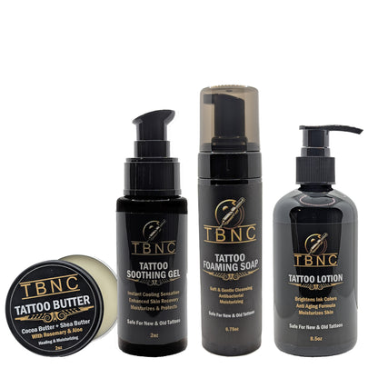 Four black TBNC - The Best Numbing Cream Tattoo Aftercare Bundle containers—Tattoo Butter, Soothing Gel, Foaming Soap, and Lotion—feature gold-accented labels for complete tattoo healing and aftercare.