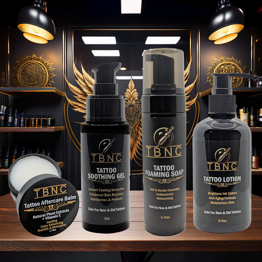 The TBNC - The Best Numbing Cream Tattoo Aftercare Bundle, featuring products for new and old tattoos, is displayed on a shelf in a sleek studio with black and gold decor.