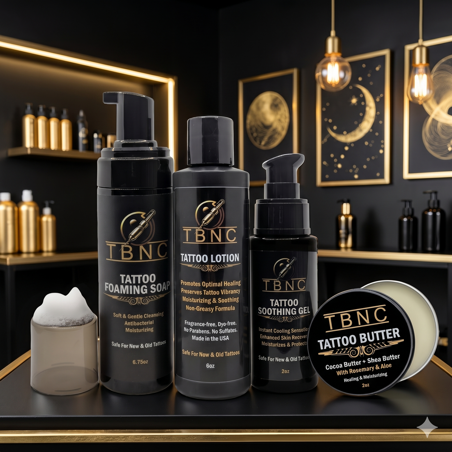 Our top-rated Tattoo Aftercare Bundle—numbing cream, soap, lotion, gel & butter—displayed in a luxe black and gold setting.