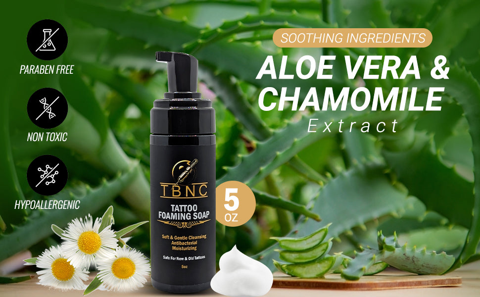 A 5 oz TBNC - The Best Numbing Cream Tattoo Foaming Soap with pump is shown among aloe vera leaves and chamomile flowers. Text notes its soothing, paraben-free, non-toxic, and hypoallergenic foaming soap formula for tattoos.