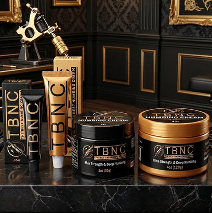 Our top-selling tattoo numbing cream sits on a marble counter, tattoo machine placed behind it.