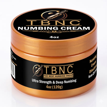 Premium gold and black jar of "Tattoo Numbing Cream ULTRA" delivers ultra-strength relief in a 4oz size with needle graphic.