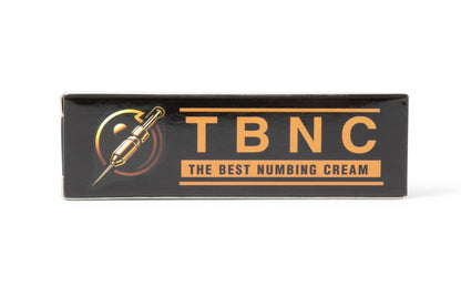 A black box with orange text that reads "TBNC - The Best Numbing Cream - 10 Pack." The design features an image of a syringe to the left of the text, emphasizing its application for painless tattoos.
