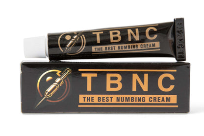 A black and orange tube from the TBNC - The Best Numbing Cream, part of a 10-pack, is placed on top of its matching box. This tattoo numbing cream is marketed for pain relief, with packaging that features an illustration of a needle to promote painless tattoos.