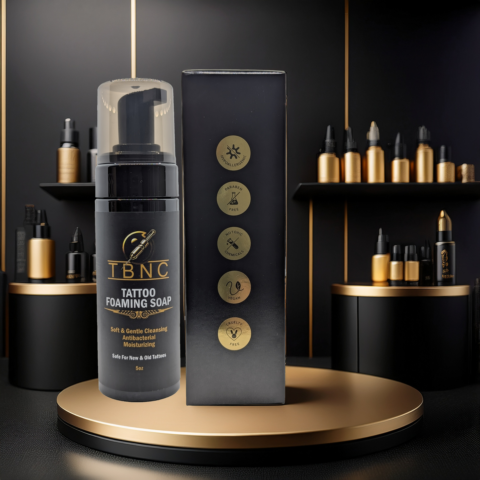 A bottle of TBNC - The Best Numbing Cream Tattoo Foaming Soap stands beside its box on a round gold platform, with shelves of gold and black bottles behind it, highlighting this luxurious antibacterial tattoo soap.
