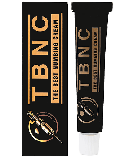 A black tube labeled "The Best Numbing Cream - TBNC" sits next to its matching box, which displays the same text and an image of a syringe. Designed for painless tattoos, the sleek box and tube feature gold and silver accents, highlighting the cream's advanced numbing properties.